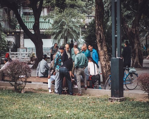 Group of people doing tai chi in park